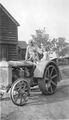 Earl, Lewis & Jeanette on Fordson tractor, 1940.jpg